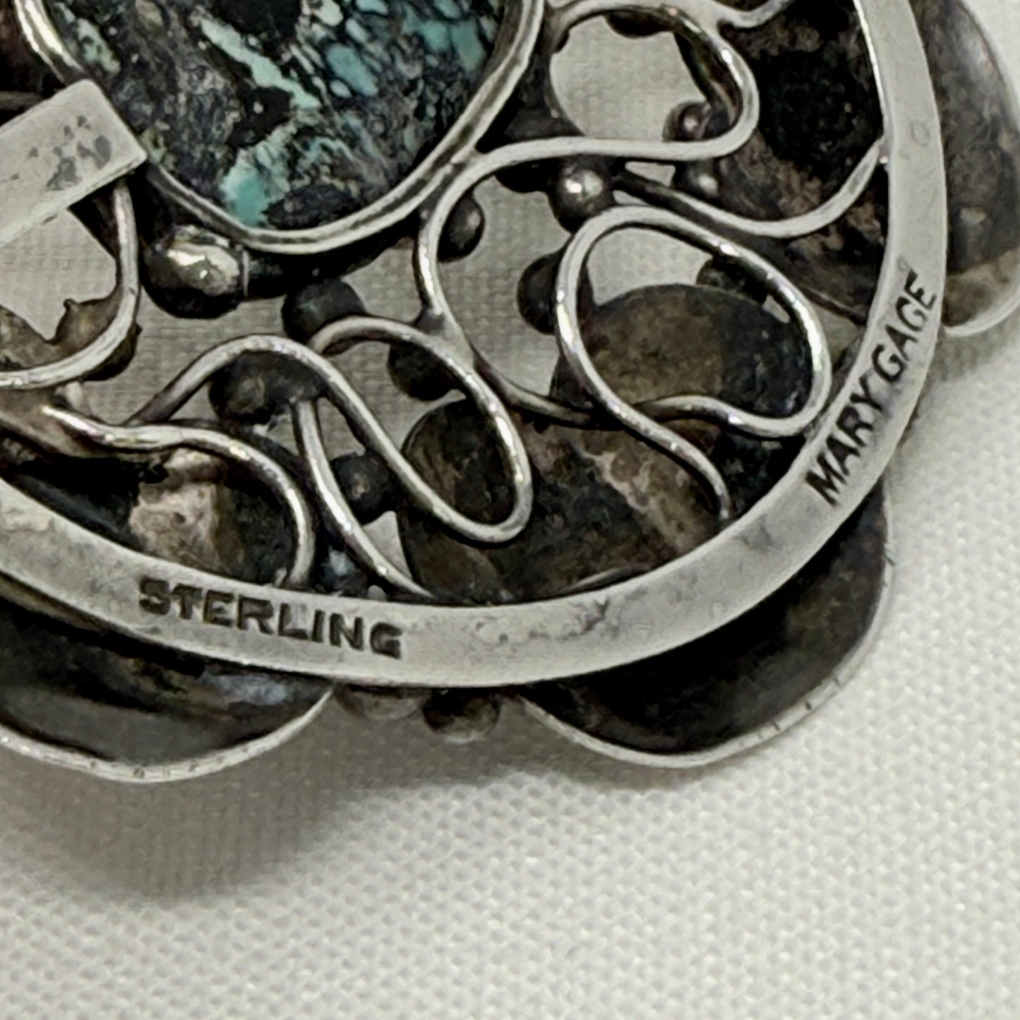 Mary Gage Sterling Silver and Spider Turquoise Round Brooch