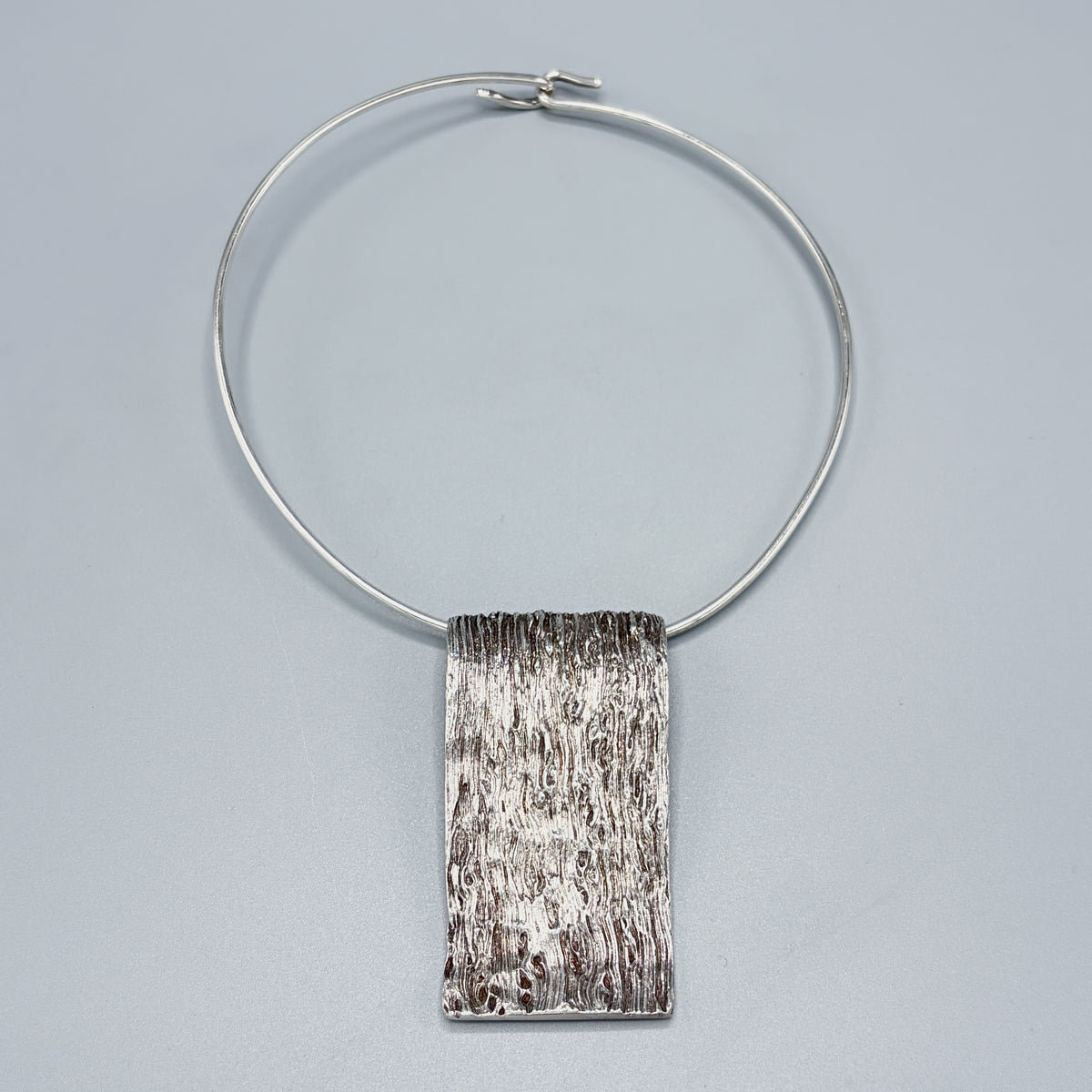 Estate Sterling Silver Knud V. Andersen Neck Ring with Bark Ribbon Pendant c 1970s